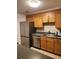 Kitchen with stainless steel appliances, oak cabinets, and light countertops at 1502 Countryside Se Pl # 1502, Smyrna, GA 30080