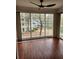 Sun room with large windows offering views of the outdoors, plus a ceiling fan at 1502 Countryside Se Pl # 1502, Smyrna, GA 30080