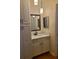 Clean bathroom with a white vanity, framed mirror, and modern lighting at 3301 Henderson Mill Rd # J1, Atlanta, GA 30341
