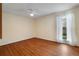 Bedroom featuring wood floors, ceiling fan and window at 3301 Henderson Mill Rd # J1, Atlanta, GA 30341