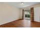 Bedroom featuring wood floors and balcony access at 3301 Henderson Mill Rd # J1, Atlanta, GA 30341