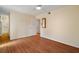 Bedroom with wood floors, ceiling fan, and neutral walls at 3301 Henderson Mill Rd # J1, Atlanta, GA 30341