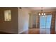 Open dining area with hardwood floors and glass doors leading to a balcony at 3301 Henderson Mill Rd # J1, Atlanta, GA 30341