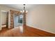 Dining room with hardwood floors and sliding door access to an outdoor patio area at 3301 Henderson Mill Rd # J1, Atlanta, GA 30341