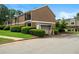 Two-story brick apartment building with manicured lawn and mature landscaping at 3301 Henderson Mill Rd # J1, Atlanta, GA 30341