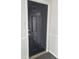 A solid black front door with unit number J-1 at 3301 Henderson Mill Rd # J1, Atlanta, GA 30341