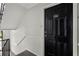 Exterior shot of unit J-1 entrance, showcasing the black door and staircase at 3301 Henderson Mill Rd # J1, Atlanta, GA 30341
