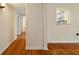 Hallway with hardwood floors leading to an open kitchen and other rooms at 3301 Henderson Mill Rd # J1, Atlanta, GA 30341