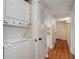 Hallway with stacked washer and dryer at 3301 Henderson Mill Rd # J1, Atlanta, GA 30341