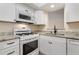 Cozy kitchen featuring granite countertops and white appliances at 3301 Henderson Mill Rd # J1, Atlanta, GA 30341
