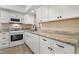 Bright kitchen with stainless sink and white cabinetry at 3301 Henderson Mill Rd # J1, Atlanta, GA 30341