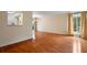 Inviting living room featuring hardwood floors, bright window, and a kitchen pass-through at 3301 Henderson Mill Rd # J1, Atlanta, GA 30341