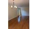 Open living room with hardwood floors and modern lighting at 3301 Henderson Mill Rd # J1, Atlanta, GA 30341