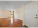 Spacious living room with hardwood floors and natural light from the large window at 3301 Henderson Mill Rd # J1, Atlanta, GA 30341