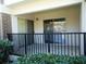 Private covered patio area with sliding glass doors and black metal railings at 3301 Henderson Mill Rd # J1, Atlanta, GA 30341