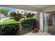 Relaxing patio space with lush greenery, brick siding, and a sliding glass door for seamless indoor-outdoor living at 3301 Henderson Mill Rd # J1, Atlanta, GA 30341