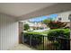 View from patio of landscaped lawn and other townhomes in the community under a bright, blue sky at 3301 Henderson Mill Rd # J1, Atlanta, GA 30341