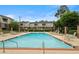 Relaxing community pool, surrounded by comfortable lounge chairs and lush landscaping, offers a tranquil retreat at 3301 Henderson Mill Rd # J1, Atlanta, GA 30341