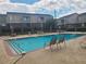 Community pool with lounge chairs and well-maintained landscaping at 3301 Henderson Mill Rd # J1, Atlanta, GA 30341