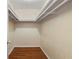 Walk-in closet showing wood floors and shelving at 3301 Henderson Mill Rd # J1, Atlanta, GA 30341