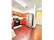 Bright kitchen featuring stainless steel appliances, cherry cabinets and hardwood floors at 3981 Isaac Ct, Lilburn, GA 30047