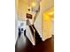 View of the staircase with dark wooden steps and wood and iron railings at 3981 Isaac Ct, Lilburn, GA 30047