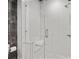 Modern glass enclosed shower with white tiling and a built in bench at 58 Canton St # 404, Alpharetta, GA 30009