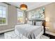Bright bedroom with large windows, plush bed, and stylish decor at 58 Canton St # 404, Alpharetta, GA 30009