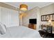 Comfortable bedroom featuring a neutral color scheme, modern lighting, and closet at 58 Canton St # 404, Alpharetta, GA 30009