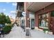 Welcoming coffee shop exterior with outdoor seating, brick facade, and sidewalk chalkboard at 58 Canton St # 404, Alpharetta, GA 30009