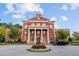 Grand government building with a classic design, manicured lawn, and circular driveway at 58 Canton St # 404, Alpharetta, GA 30009