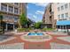 Charming courtyard featuring a central fountain, landscaping, and nearby shops at 58 Canton St # 404, Alpharetta, GA 30009