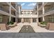 A peaceful courtyard with a water feature and plenty of outdoor seating at 58 Canton St # 404, Alpharetta, GA 30009