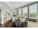 Chic dining room with a glass table, designer lighting, and large windows at 58 Canton St # 404, Alpharetta, GA 30009