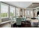 Well-lit dining area with a glass table, stylish seating, and large windows at 58 Canton St # 404, Alpharetta, GA 30009
