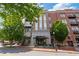 Building exterior featuring brick facade, decorative windows, and street-side dining at 58 Canton St # 404, Alpharetta, GA 30009