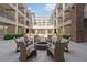 Fire pit seating area in the courtyard with comfortable chairs at 58 Canton St # 404, Alpharetta, GA 30009