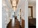 Long hallway leads to a spacious living area with hardwood floors and bright lighting at 58 Canton St # 404, Alpharetta, GA 30009