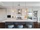 Stunning kitchen with marble countertops, stainless appliances, island seating and ample cabinetry at 58 Canton St # 404, Alpharetta, GA 30009