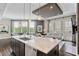 Spacious kitchen island with marble countertop overlooking the living and dining areas at 58 Canton St # 404, Alpharetta, GA 30009