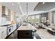 Modern kitchen with a large island, stainless steel appliances, and a view of the living area at 58 Canton St # 404, Alpharetta, GA 30009