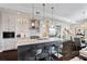 Gorgeous kitchen featuring a center island, stylish pendant lighting, and stainless steel appliances at 58 Canton St # 404, Alpharetta, GA 30009