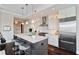 Spacious kitchen featuring marble countertops, stainless appliances, and island seating for three at 58 Canton St # 404, Alpharetta, GA 30009