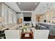 Bright and open living room featuring a fireplace, modern furnishings, and hardwood floors at 58 Canton St # 404, Alpharetta, GA 30009