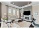Sophisticated living room with a fireplace and ample seating, open to the kitchen area at 58 Canton St # 404, Alpharetta, GA 30009
