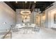 A spacious living room with an eye-catching chandelier, comfortable seating, and stylish decor at 58 Canton St # 404, Alpharetta, GA 30009