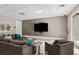 Inviting lounge area with comfortable seating, large screen television, and ample natural light at 58 Canton St # 404, Alpharetta, GA 30009
