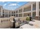 An inviting patio featuring an outdoor grill, flowers, and architectural details at 58 Canton St # 404, Alpharetta, GA 30009