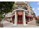 Attractive Kilwins storefront with red awnings, decorative columns and a balcony overhead at 58 Canton St # 404, Alpharetta, GA 30009