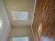 A bedroom with hardwood floor, two windows with white frames and blinds at 6136 Holiday Blvd, Forest Park, GA 30297
